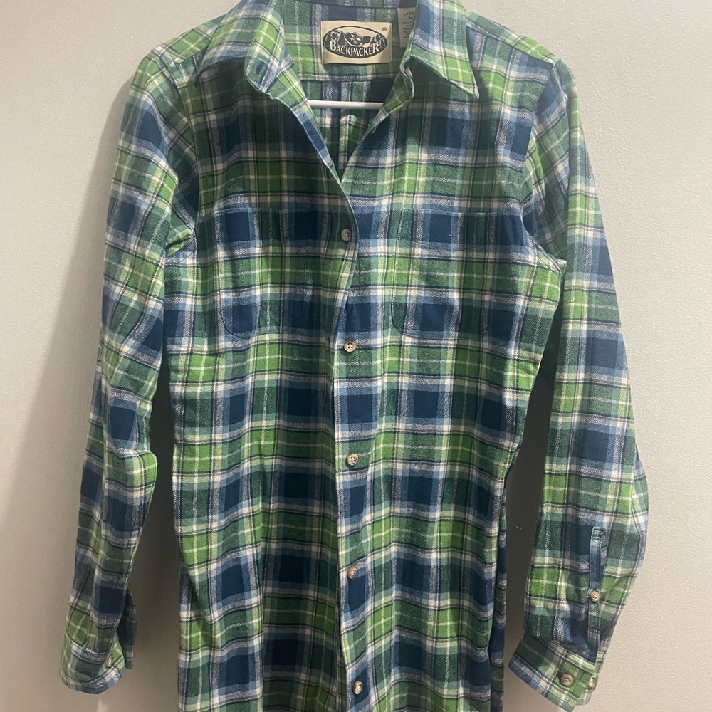 Two Backpacker brand women’s long sleeved plaid shirts, size medium.